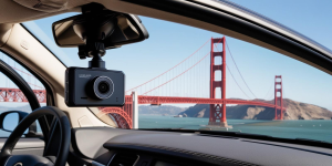 Dashcam mounted on car windshield capturing footage of the Golden Gate Bridge during a drive